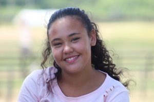 12,Year,Old,Girl,With,Long,Black,Hair,,Smiling,,Standing