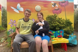 Young family on new garden bench 