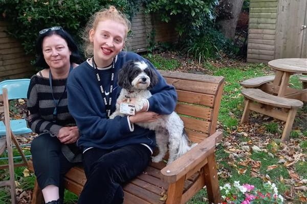 Garden update Trish Jade and Heidi the dog sat on a new bench