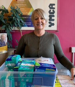 Rachel holding box of period products