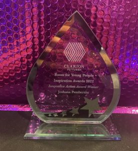 Glass diamond shape award for Joshana's work at YAC food market