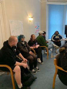 The youth council in a meeting sat discussing various topics