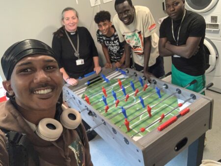 Elly is ordained. Elly with young residents in Guildford.