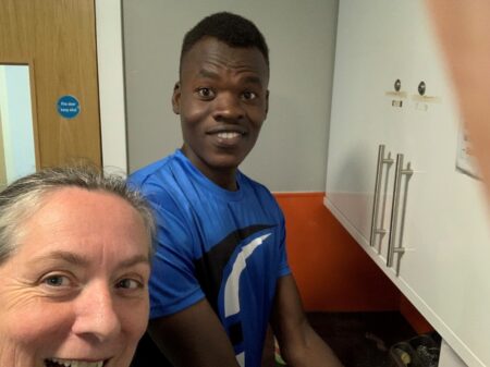 Elly is ordained. Elly with resident of YMCA DownsLink Group