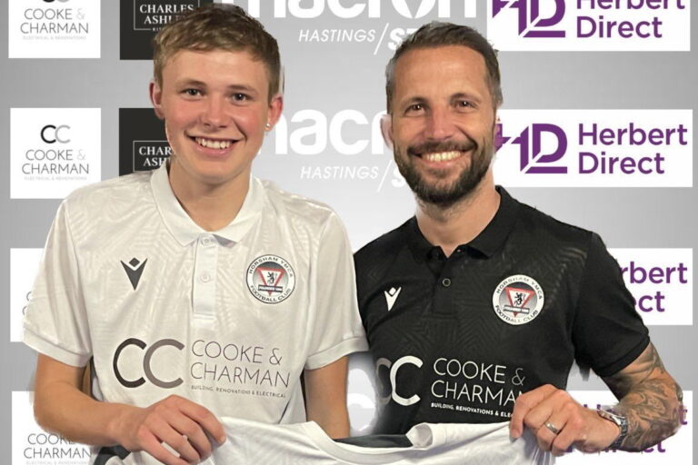 Tom Hearn player with coach for banner