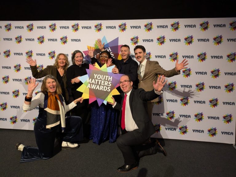 Chaplaincy nominees on stage holding a Youth Matter Awards sign