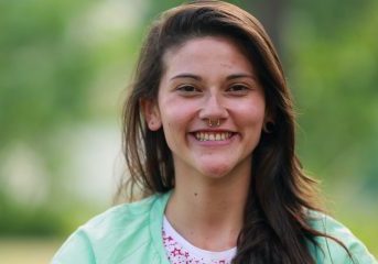 Young,Woman,Taking,A,Deep,Breath,Outdoors,Feeling,Relaxed,And