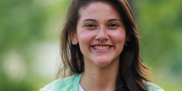 Young,Woman,Taking,A,Deep,Breath,Outdoors,Feeling,Relaxed,And